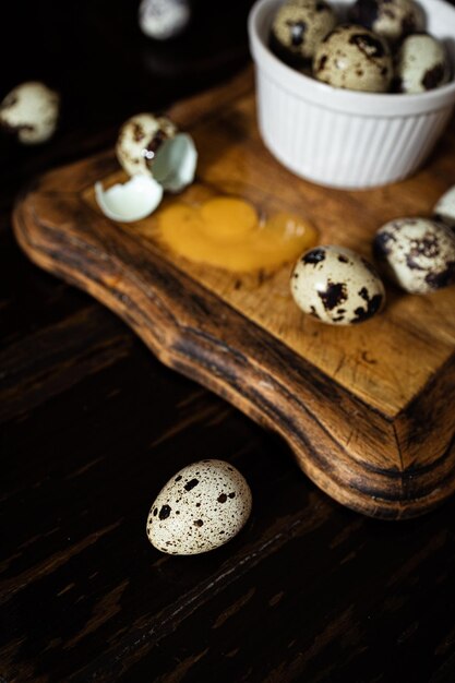 Photo broken quail egg with yolk fresh and natural farm produce