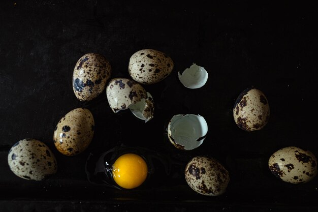 Photo broken quail egg with yolk fresh and natural farm produce