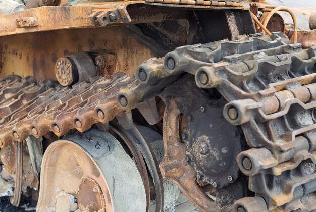 Broken undercarriage and caterpillar of the combat tank