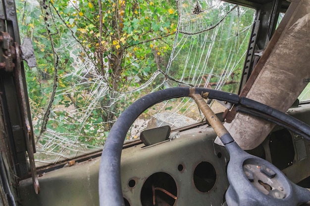 Broken windshield in an old abandoned car