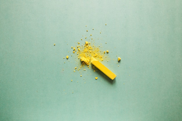 Broken yellow chalk explosion