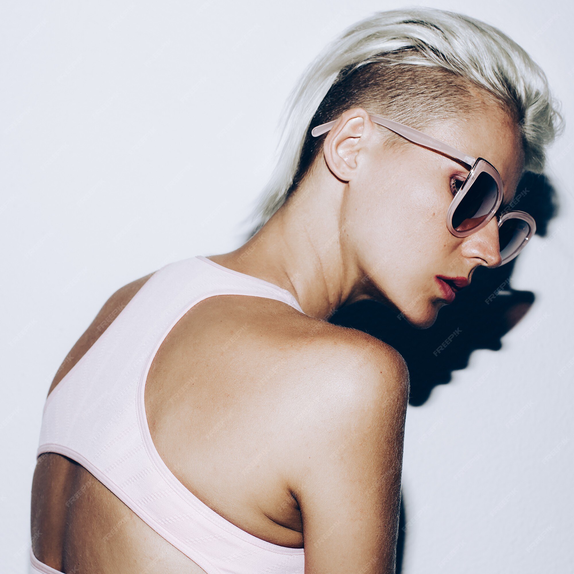 Premium Photo | Bronze blonde with short hair and fashionable sunglasses. summer trend Premium Photo | Bronze blonde with short hair and fashionable sunglasses. summer trend