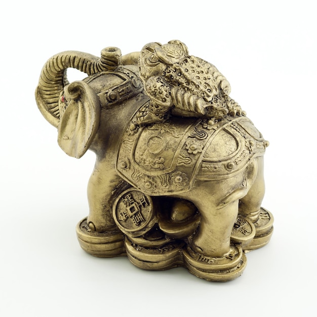 Bronze elephant and a frog on a white background