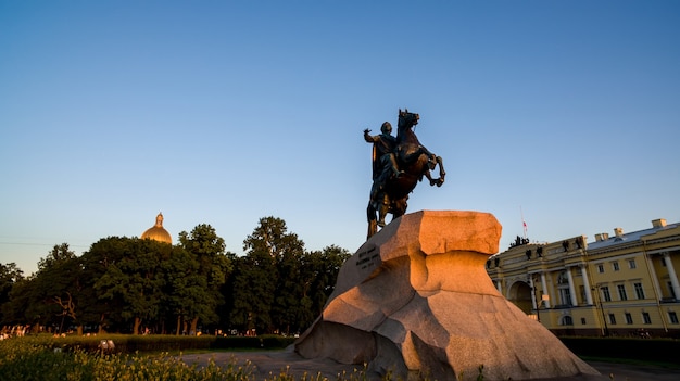 Bronze horseman monument illuminated sunset