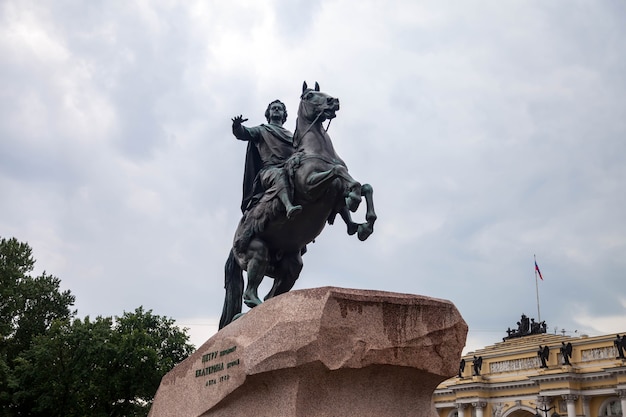Bronze horseman monument on Neva river embankment on cloudy day