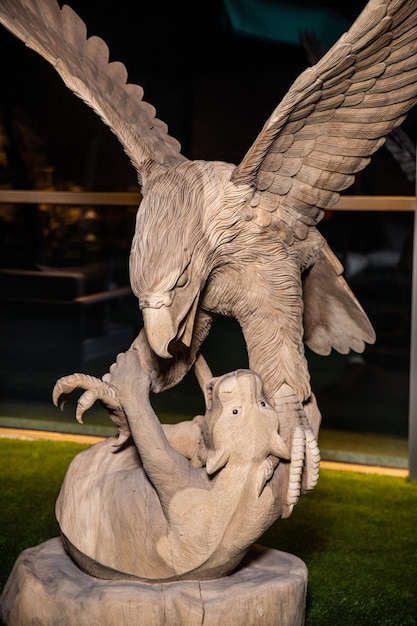 A bronze sculpture of an eagle fighting with an eagle.