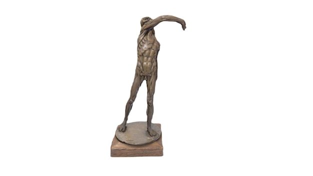 A bronze sculpture of a man with his arms raised