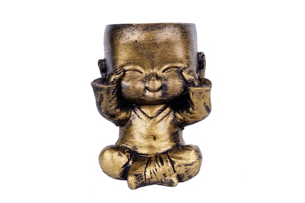A bronze statue of a buddha with his eyes closed.