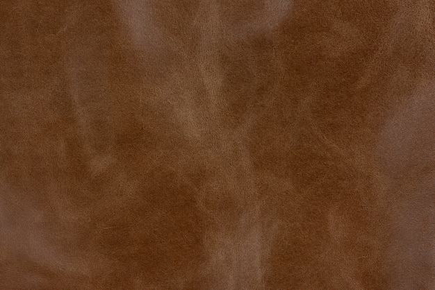 Bronze textured smooth leather surface background, small grain