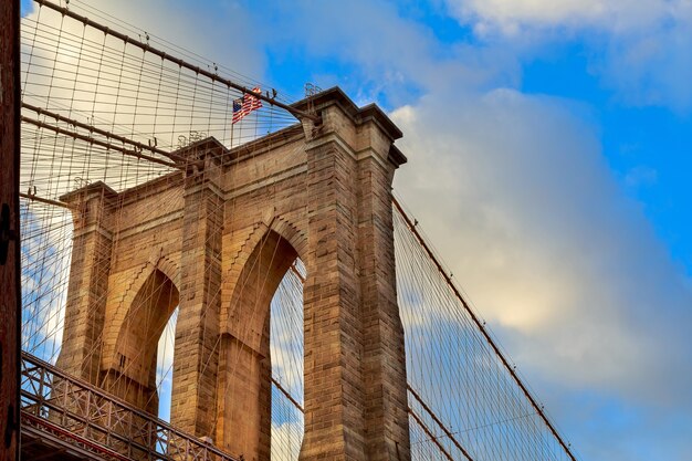 The Brooklyn Bridge, New York. Architectural detail at summer sunset. Brooklyn Bridge pylon