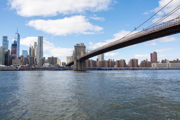 brooklyn bridge in new york seen from the shoreline