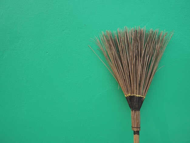 The broom handmade from coconut for cleaning the floor