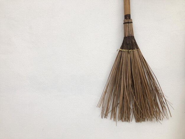 Broom made of twigs isolated on a white background