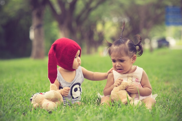 Brother calms a crying sister