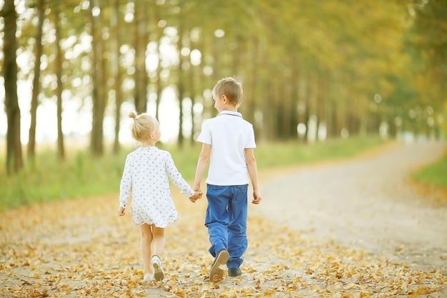 Brother and sister Autumn road