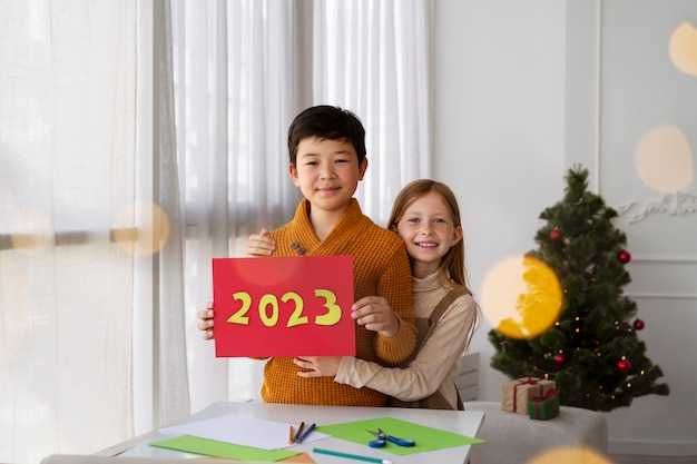 Brother and sister celebrating new years eve at home together