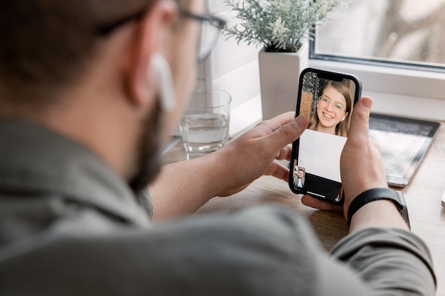 Brother and sister communicate at a distance during the war in Ukraine via video call No war