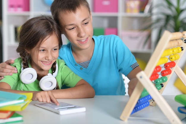 Brother and sister doing homework together