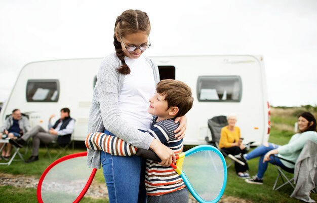 Brother and sister embracing after a tennis match