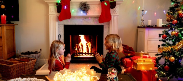 Brother and sister at home at Christmas time