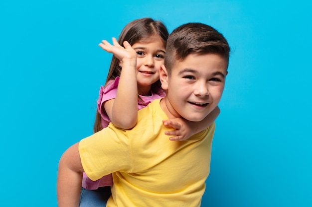 Brother and sister playing with happy expression