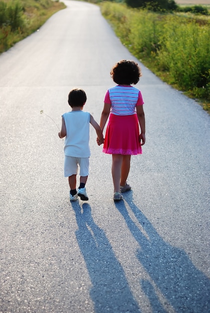 Brother and sister walking 