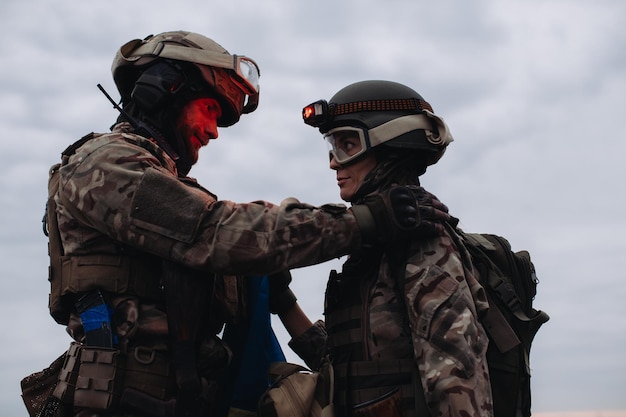 Brothers in arms man and woman military against the background of the sky War Ukraine and Russia