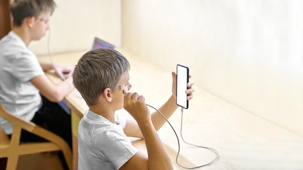 Brothers use electronic devices connected directly to head