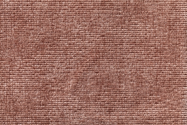 Brown background from soft textile material.