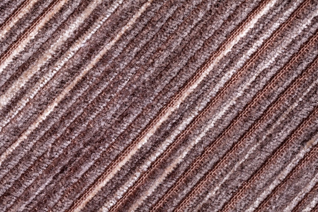 Brown background of a knitted textile material