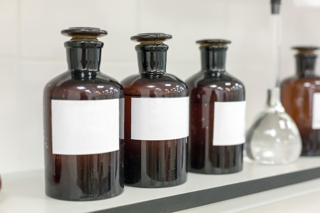 Photo brown bottles on shelf in the laboratory.