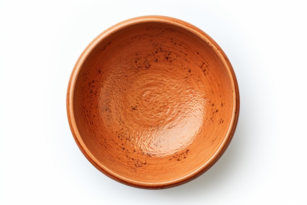 a brown bowl on a white surface