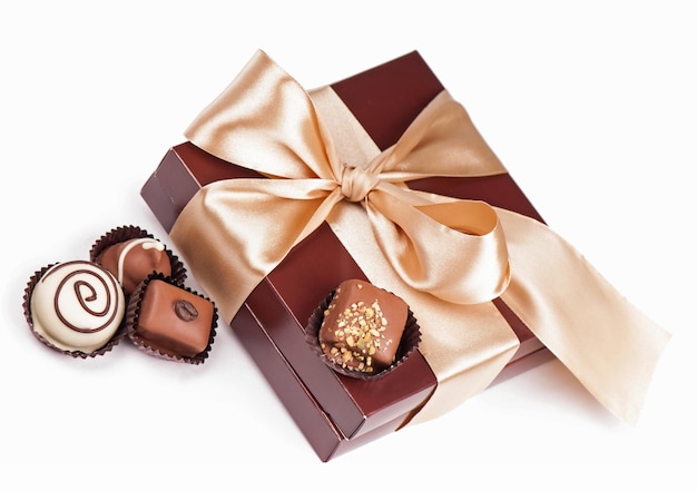 Brown box with candies and golden tape