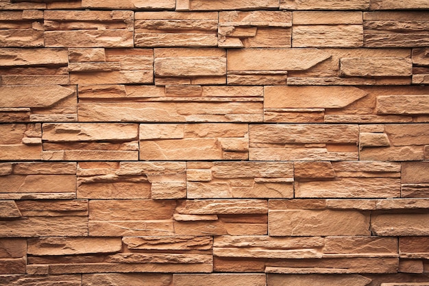 Brown brick wall or stone wall texture and background