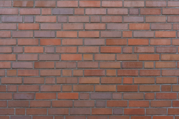 Photo brown bricks masonry wall as background or texture.