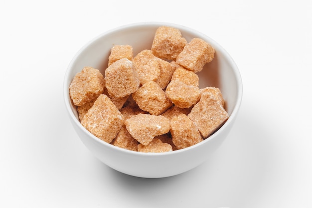 Brown cane sugar cubes isolated