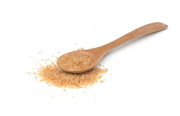 Brown cane sugar on white background