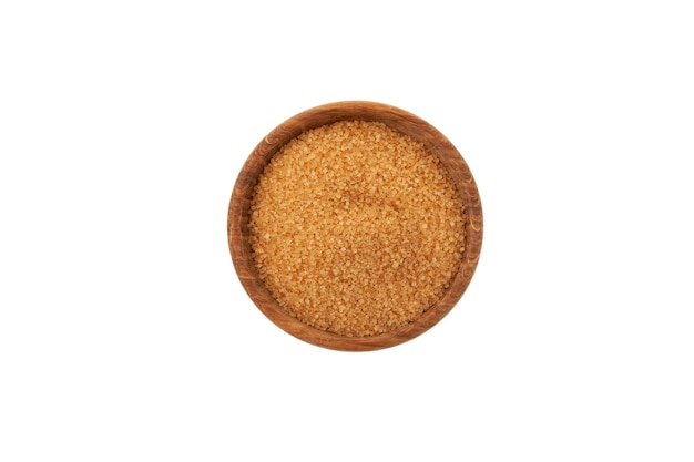 Brown cane sugar in wooden bowl isolated on white background, top view.