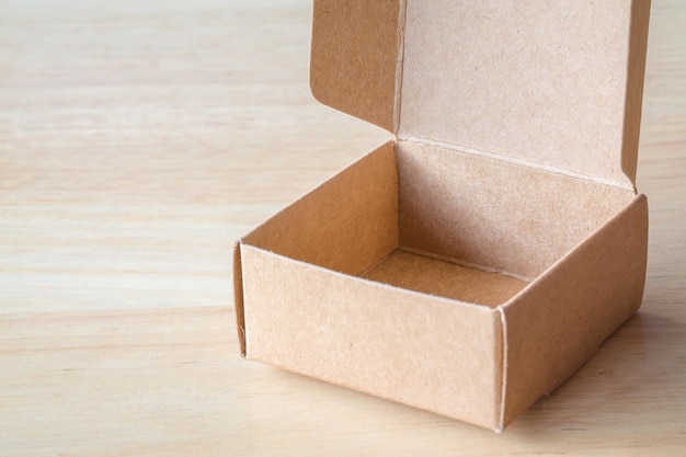 Brown cardboard box on wooden background picture used design
