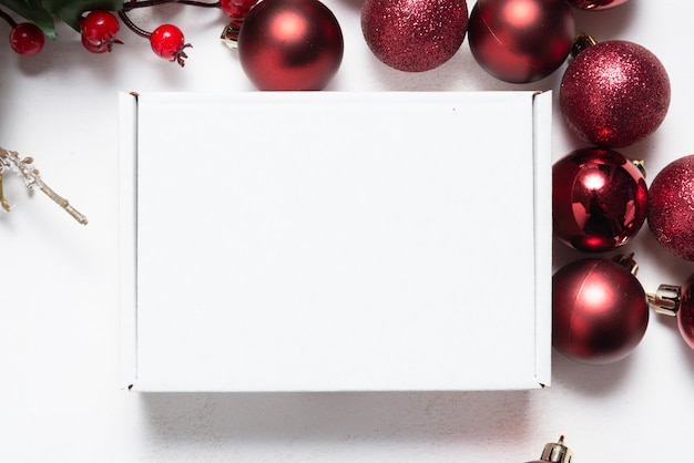 Brown cardboard mailer box decorated with Christmas ornaments