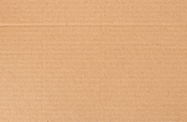 Коричневый картонный лист текстуры переработанной бумажной коробки