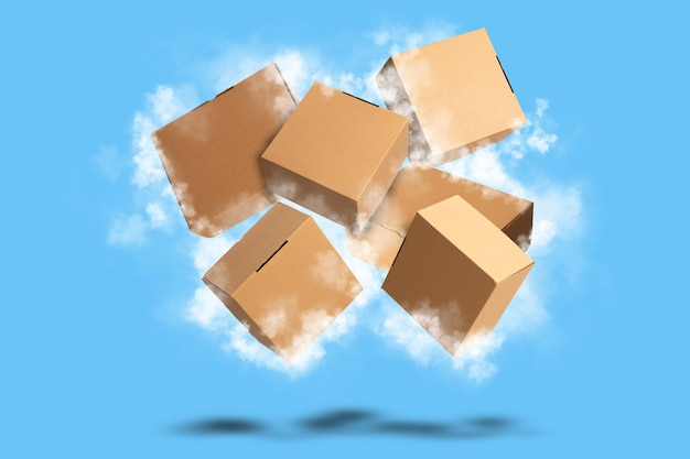 Foto scatola di cartone in cartone marrone che vola con nuvole su sfondo blu