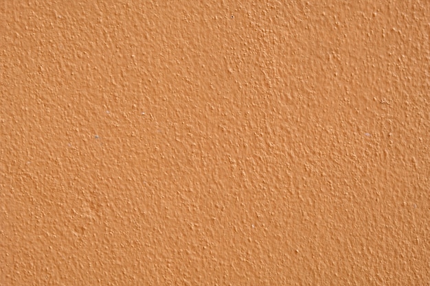 Brown cement wall background close up