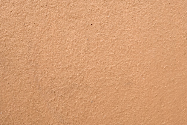 Brown cement wall background close up