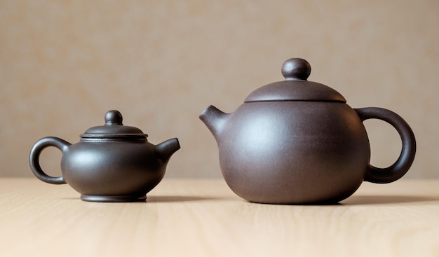 Brown ceramic Chinese teapots on the table