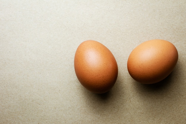 Brown chicken eggs on recycled craft paper