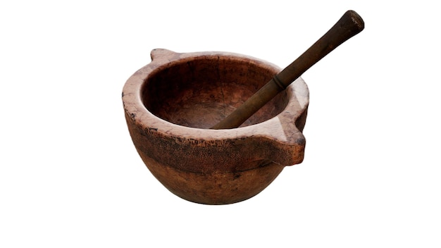 A brown clay mortar with a wooden handle is next to a wooden spoon.