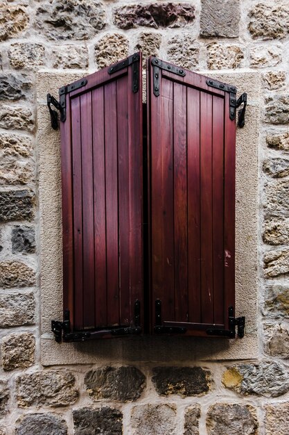 Brown closed wooden window in the old town