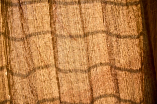 A brown cloth with a pattern of lines on it