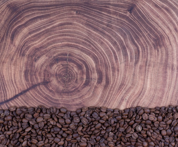 brown coffee beans on an old wooden table